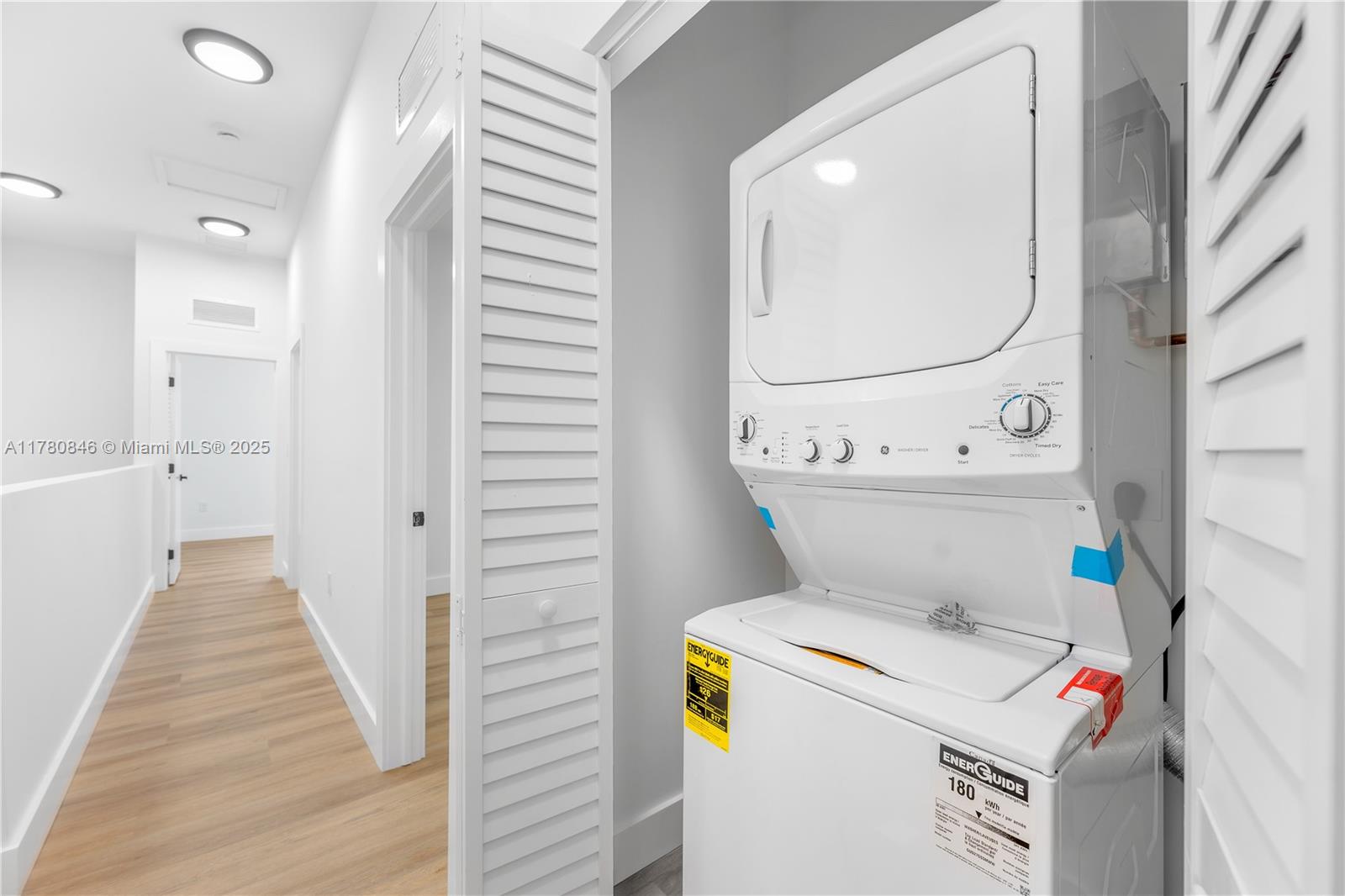 2121 Northwest 45th Street, Unit 2123 Miami, FL 33142 - Photo 16 of 24 a utility room with dryer and washer