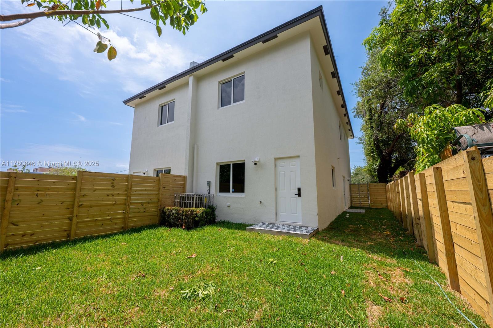 2121 Northwest 45th Street, Unit 2123 Miami, FL 33142 - Photo 20 of 24 a view of a backyard
