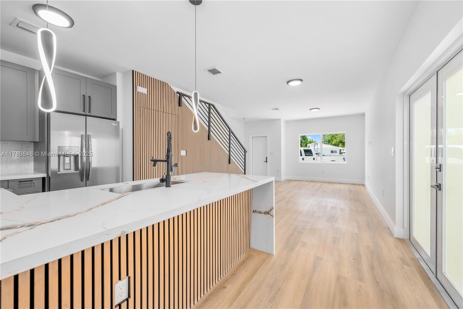 2121 Northwest 45th Street, Unit 2123 Miami, FL 33142 - Photo 3 of 24 a view of an entryway with wooden floor