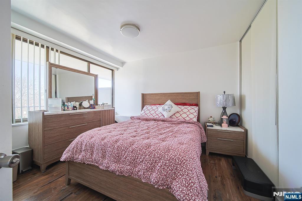 277 Prospect Avenue, Unit 4A Hackensack, NJ 07601 - Photo 13 of 27 a bedroom with a bed and a window