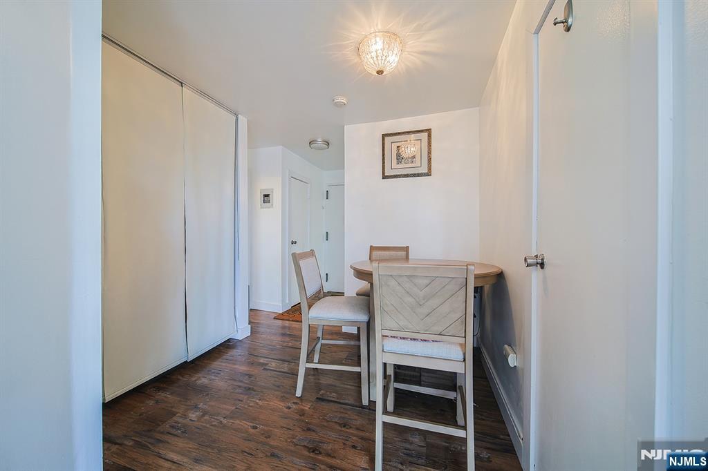 277 Prospect Avenue, Unit 4A Hackensack, NJ 07601 - Photo 14 of 27 a view of a livingroom with furniture and wooden floor