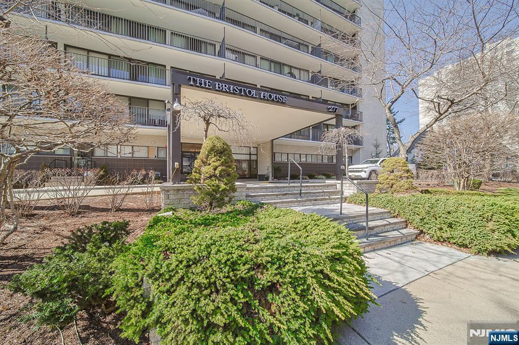 277 Prospect Avenue, Unit 4A Hackensack, NJ 07601 - Photo 23 of 27 a front view of a building with garden