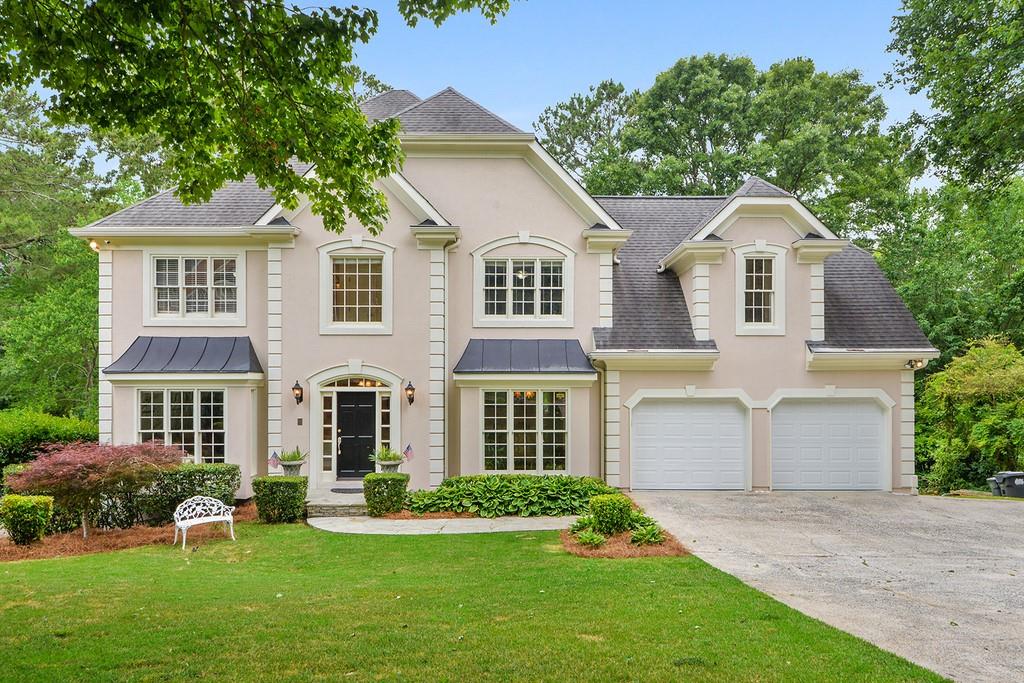 121 Ridgetree Lane Northeast Marietta, GA 30068 - Photo 1 of 1 front view of a house with a yard