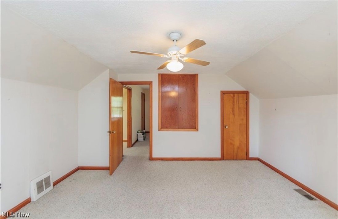 4521 Emerson Road South Euclid, OH 44121 - Photo 30 of 47 Carpeted interior space featuring white walls and a sloped ceiling