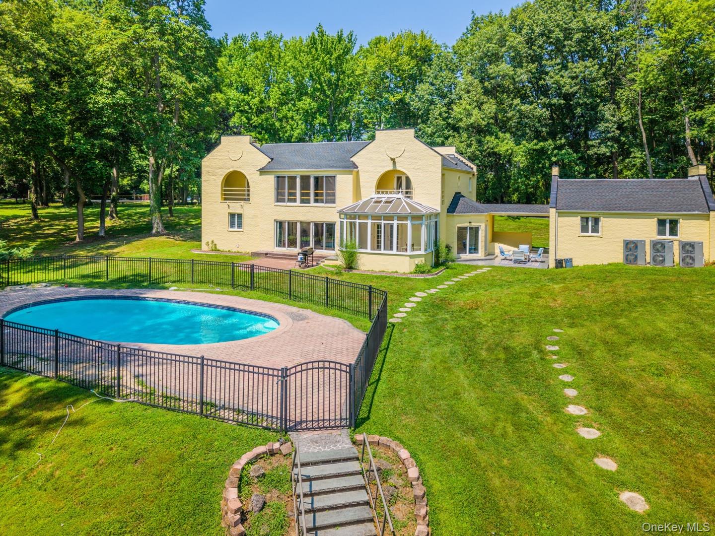 530 South Centre Island Road Centre Island, NY 11771 - Photo 1 of 32 View of pool with a sunroom and a patio area