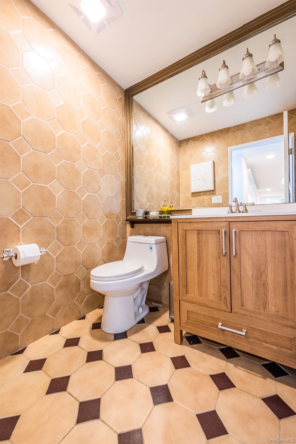 530 South Centre Island Road Centre Island, NY 11771 - Photo 15 of 32 Bathroom with tile walls and vanity