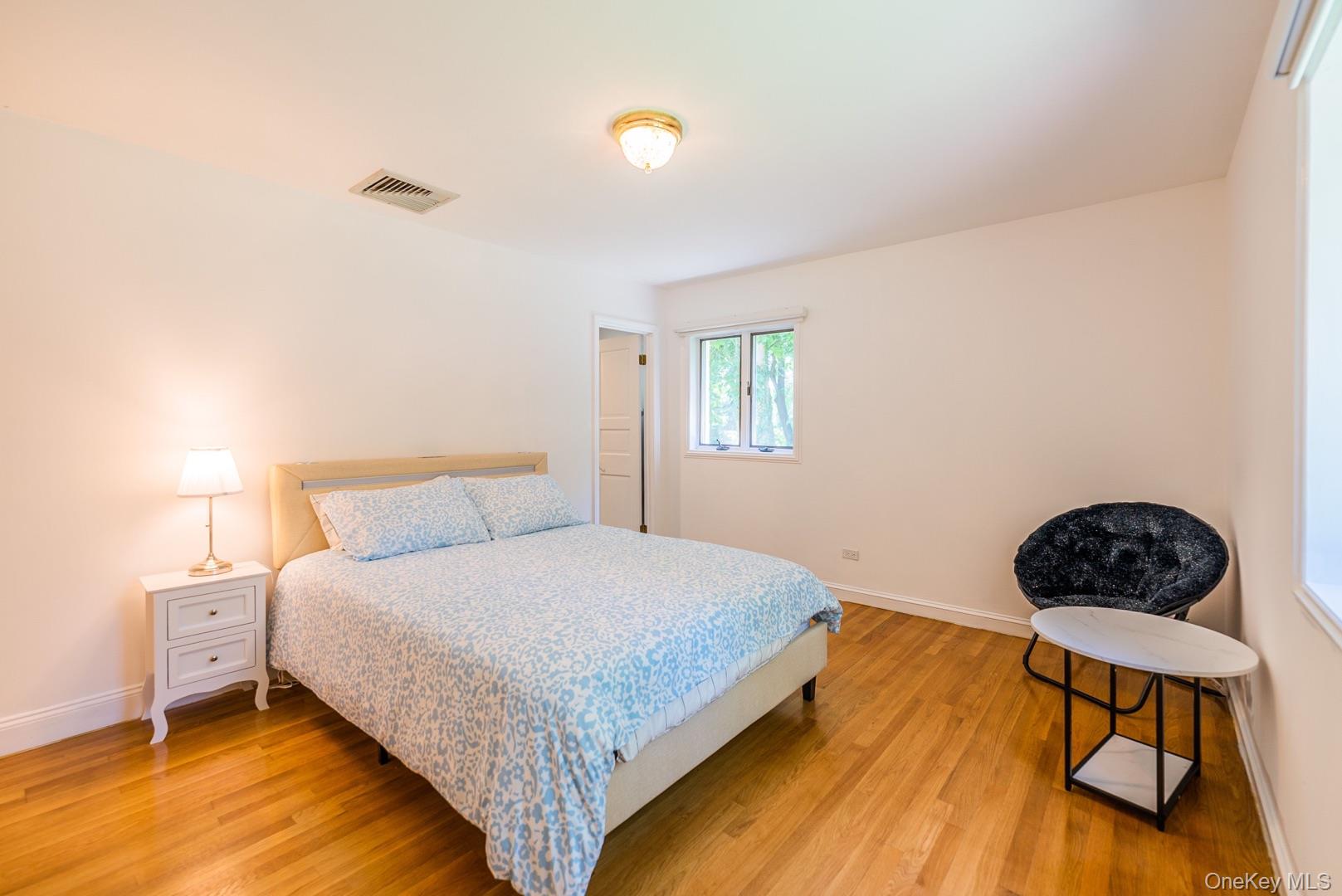 530 South Centre Island Road Centre Island, NY 11771 - Photo 24 of 32 Bedroom with light wood-style flooring