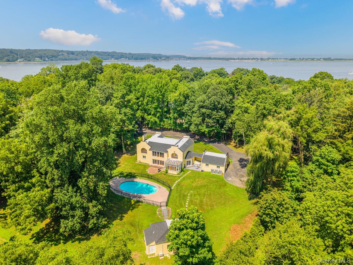 530 South Centre Island Road Centre Island, NY 11771 - Photo 31 of 32 View from above of property featuring a pool area and a large body of water