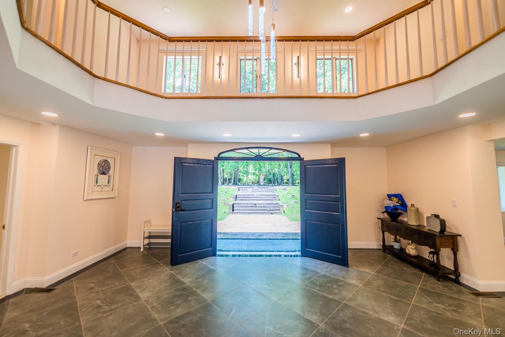 530 South Centre Island Road Centre Island, NY 11771 - Photo 6 of 32 Entrance foyer with a high ceiling and recessed lighting