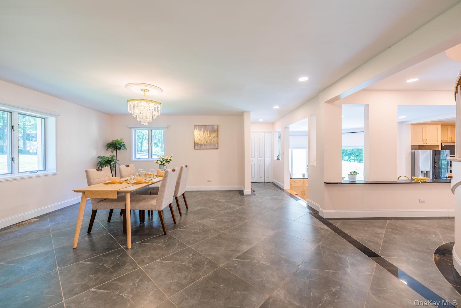 530 South Centre Island Road Centre Island, NY 11771 - Photo 8 of 32 Dining room featuring healthy amount of natural light, a chandelier, and recessed lighting