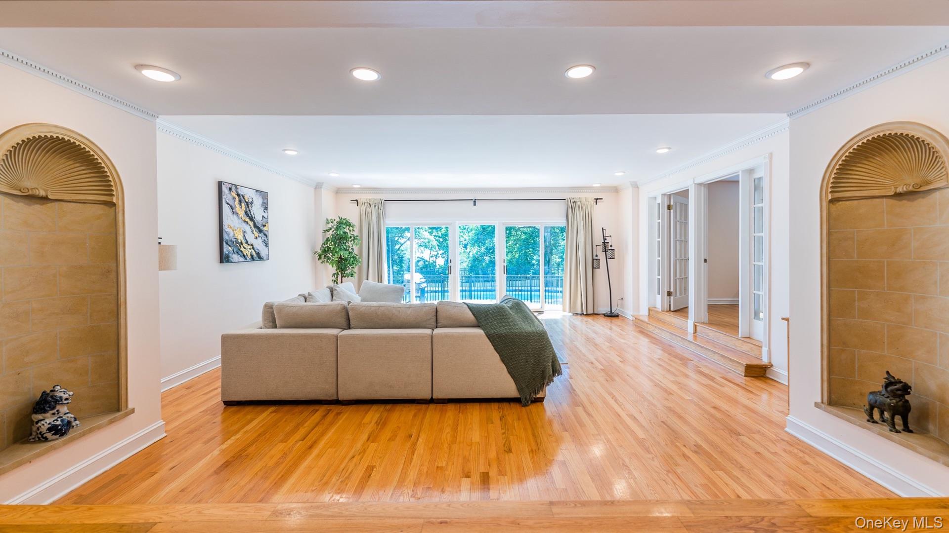 530 South Centre Island Road Centre Island, NY 11771 - Photo 9 of 32 Living room featuring light wood-style floors, ornamental molding, and recessed lighting