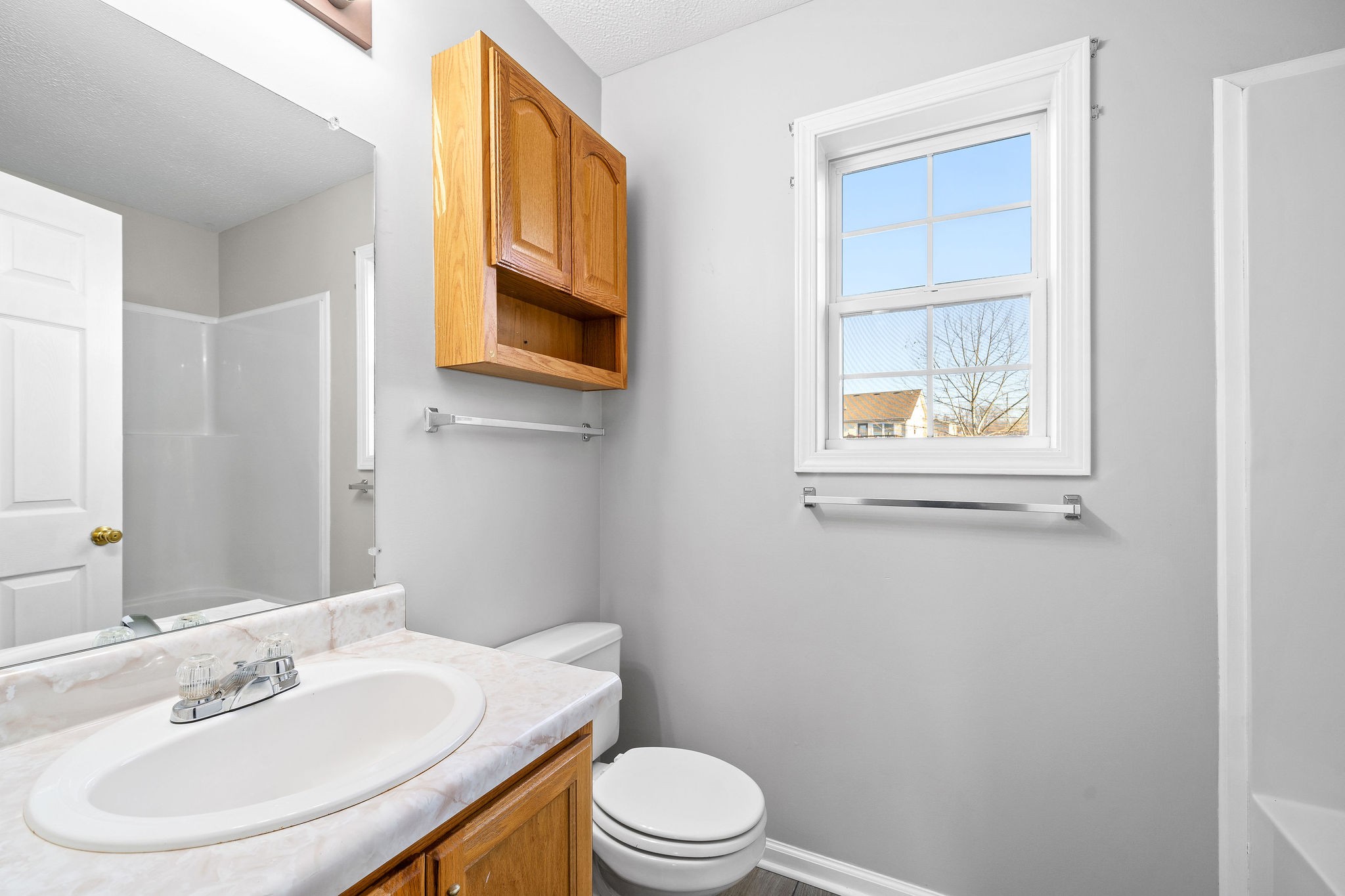 2904 Core Drive Clarksville, TN 37040 - Photo 17 of 23 a bathroom with a sink a mirror and a toilet