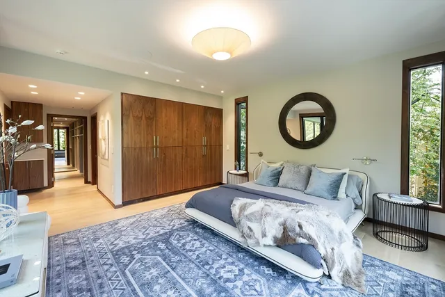 a bathroom with a tub sink and mirror
