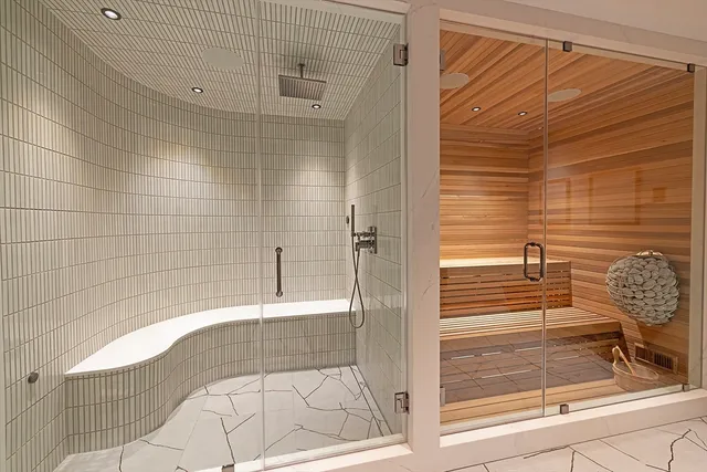 a living room with furniture and a kitchen counter space