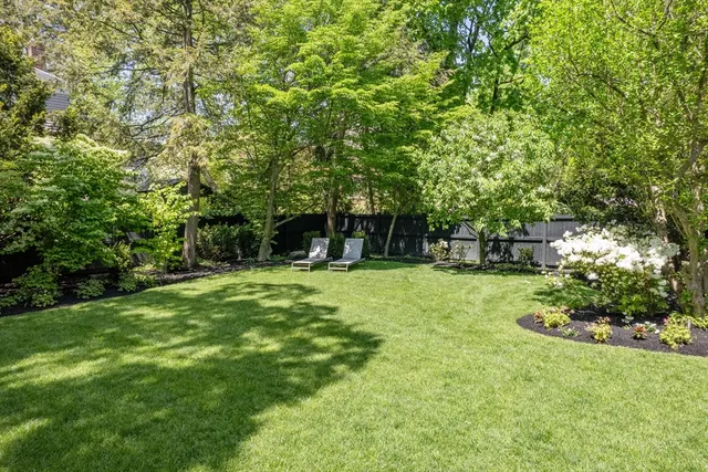 a view of a kitchen with a stove and kitchen island