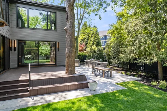 a backyard of a house with outdoor seating