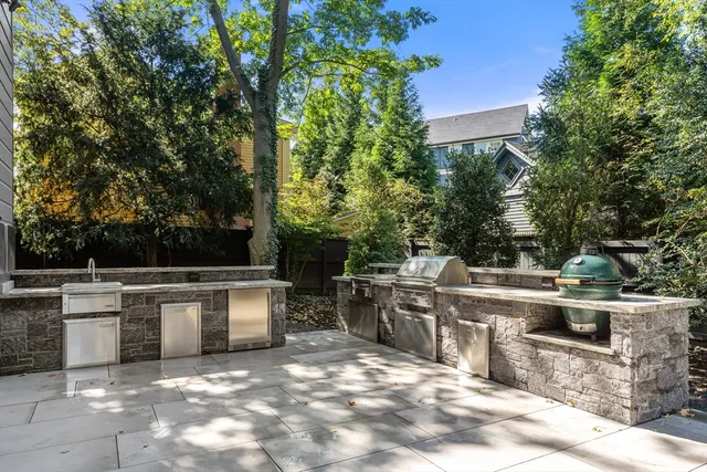 a view of a patio with table and chairs and potted plants