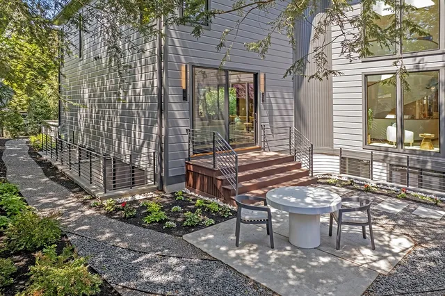an aerial view of multiple house with a yard