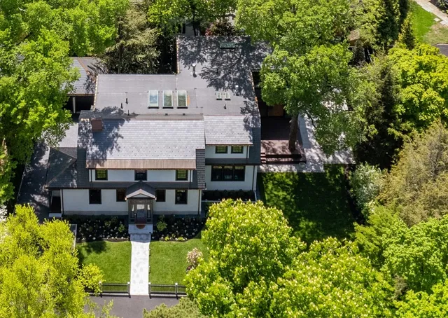 a front view of a building with a garden