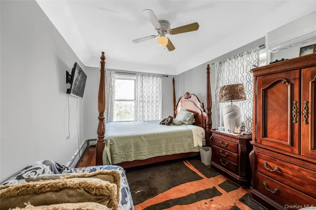 a bathroom with a granite countertop toilet sink and mirror