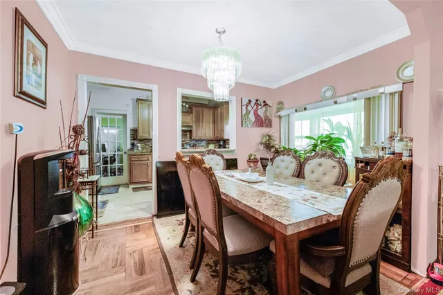 a living room with furniture chess board and a large window