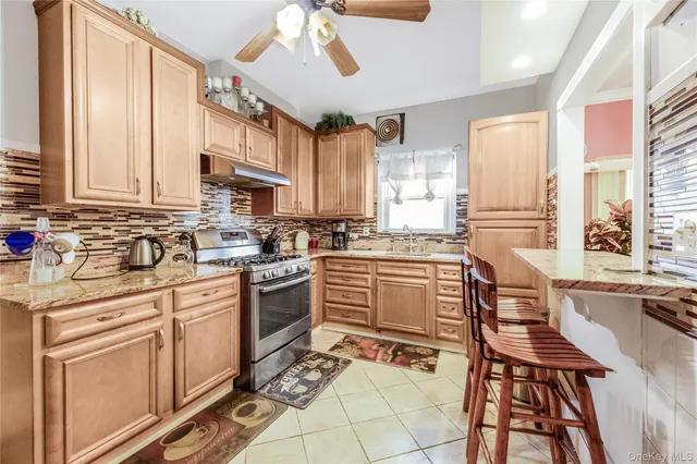 a view of a building with cars parked