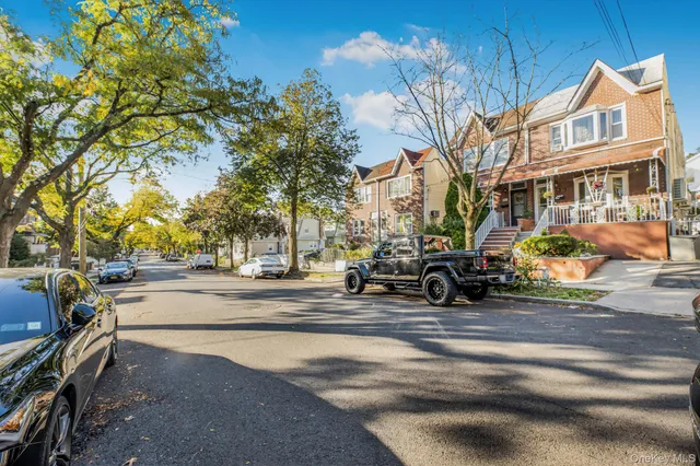 a view of a building with cars parked