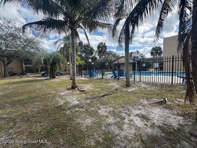 240 Spring Drive, Unit 5 Merritt Island, FL 32953 - Photo 12 of 17 a view of outdoor space with trees