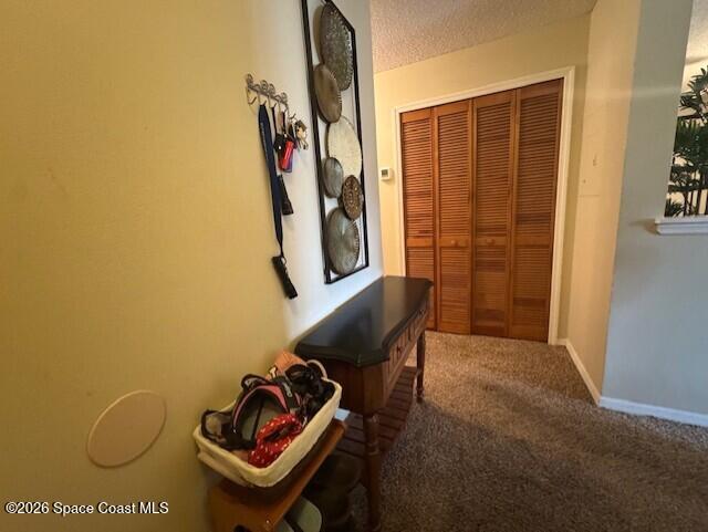 240 Spring Drive, Unit 5 Merritt Island, FL 32953 - Photo 13 of 17 a view of a door and chair in a room