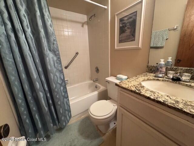 240 Spring Drive, Unit 5 Merritt Island, FL 32953 - Photo 14 of 17 a bathroom with a granite countertop sink toilet and shower