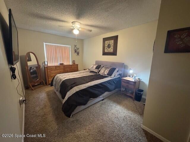 240 Spring Drive, Unit 5 Merritt Island, FL 32953 - Photo 15 of 17 a bed room with a bed and a tv