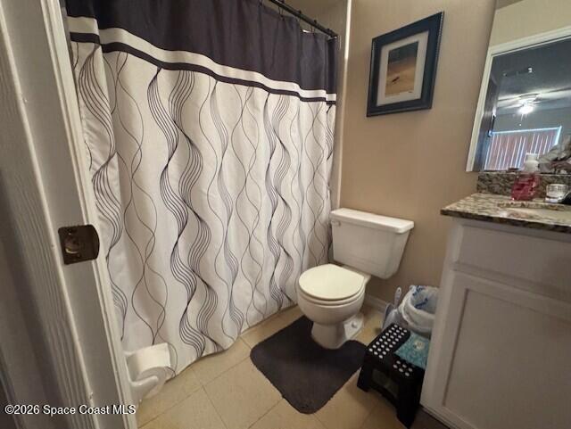 240 Spring Drive, Unit 5 Merritt Island, FL 32953 - Photo 16 of 17 a white toilet sitting next to a bathroom sink