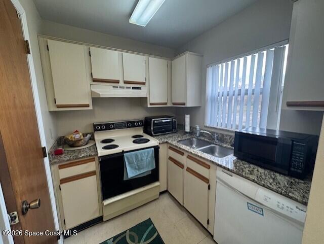 240 Spring Drive, Unit 5 Merritt Island, FL 32953 - Photo 6 of 17 a kitchen with a stove and a sink