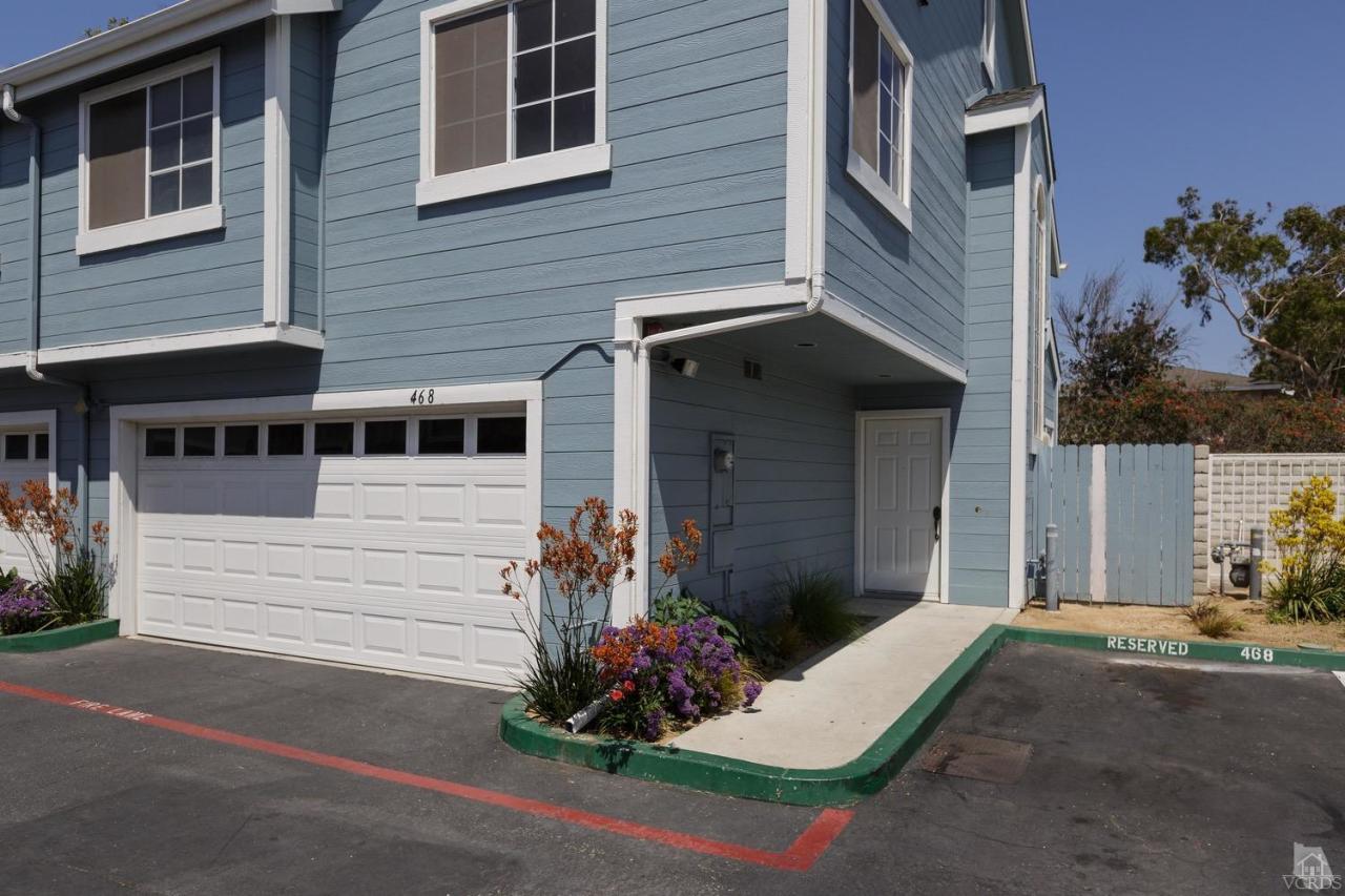 468 West Wooley Road Oxnard, CA 93030 - Photo 1 of 16 a front view of a house with a yard