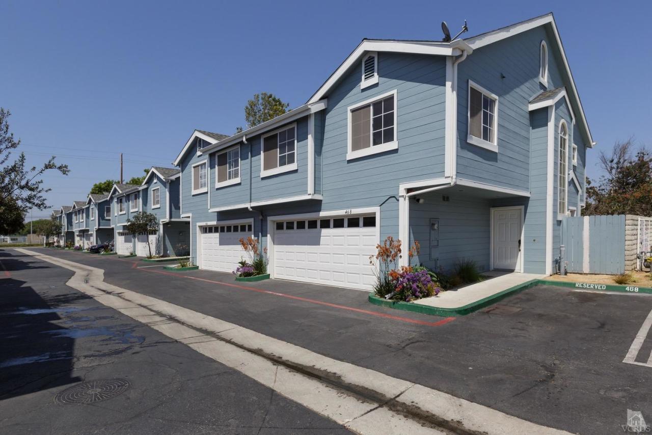 468 West Wooley Road Oxnard, CA 93030 - Photo 2 of 16 a front view of a house with a street