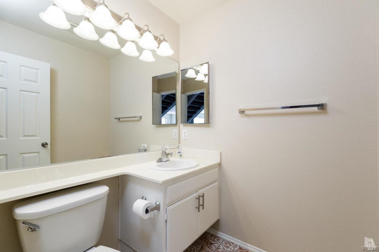 468 West Wooley Road Oxnard, CA 93030 - Photo 9 of 16 a bathroom with a sink vanity and mirror