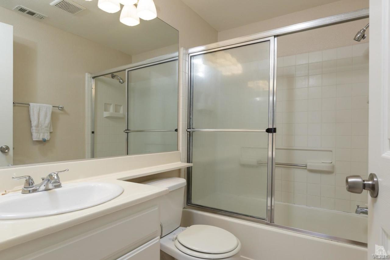 468 West Wooley Road Oxnard, CA 93030 - Photo 10 of 16 a bathroom with a sink a toilet and shower
