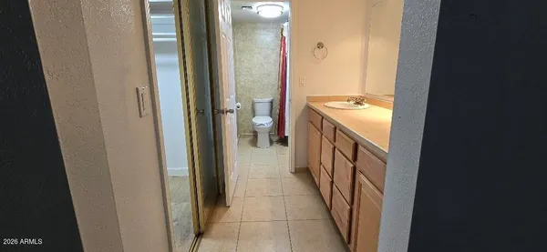 a bathroom with a sink and mirror
