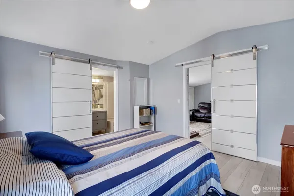 a bedroom with a bed and a closet