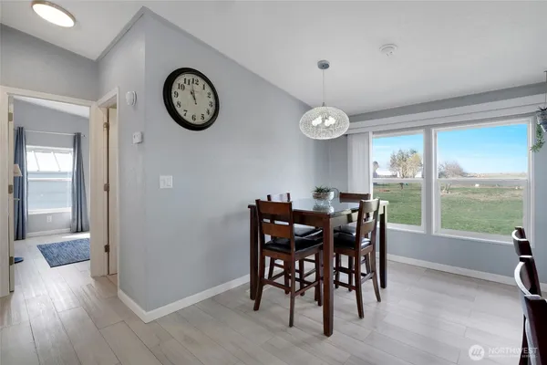 a view of a dining room with furniture window and wooden floor