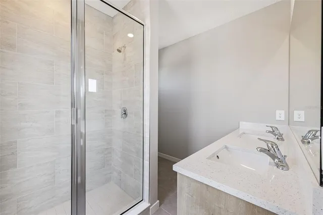 a bathroom with a sink and shower