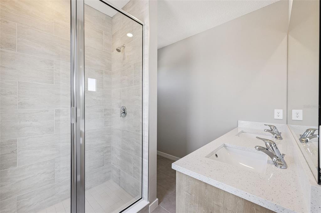 544 North Bumby Avenue, Unit 5 Orlando, FL 32803 - Photo 12 of 26 a bathroom with a sink and shower