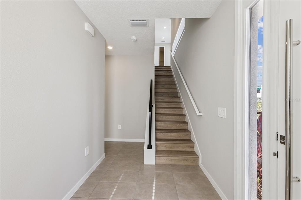 544 North Bumby Avenue, Unit 5 Orlando, FL 32803 - Photo 2 of 26 a view of a hallway with wooden floor and entryway