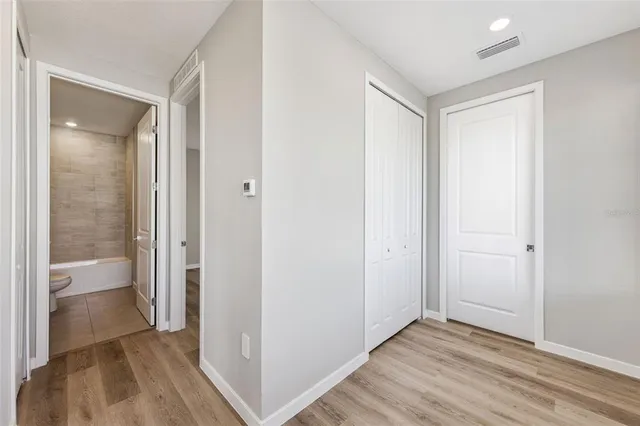 a view of entryway with wooden floor