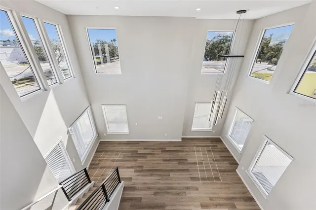 a view of an entryway with wooden floor