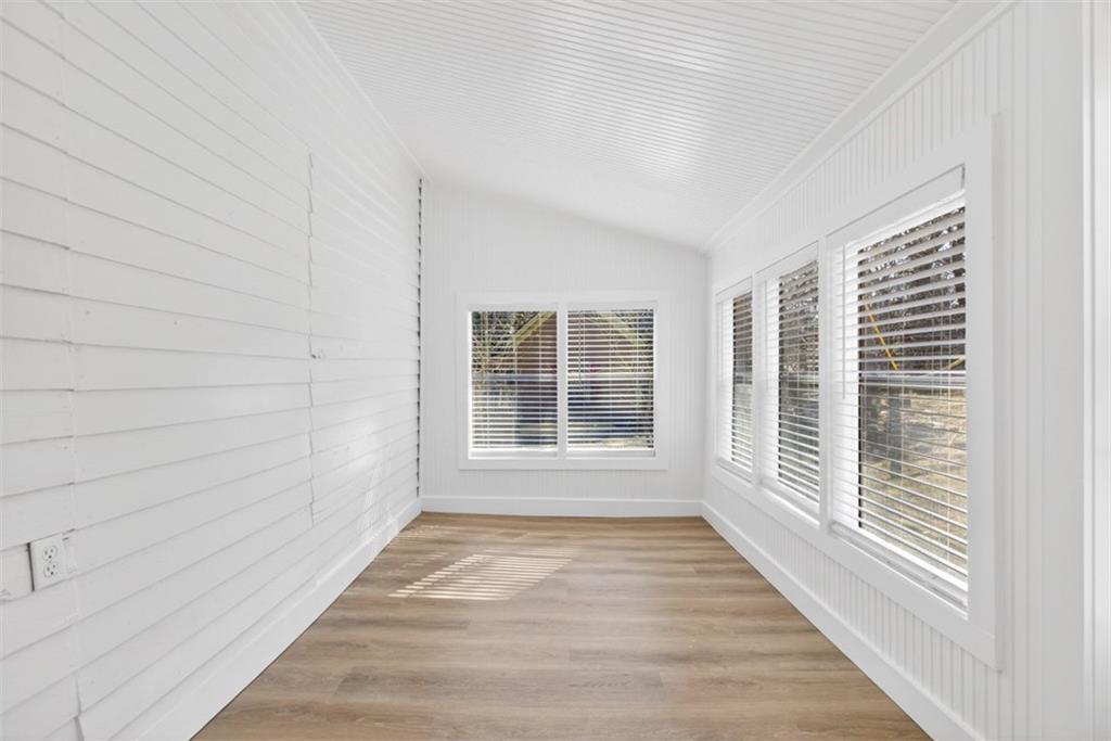 246 Spring Street Commerce, GA 30529 - Photo 19 of 23 a view of empty room with wooden floor and fan