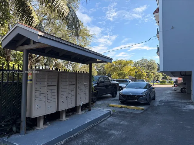 a view of a car is parked in front of house