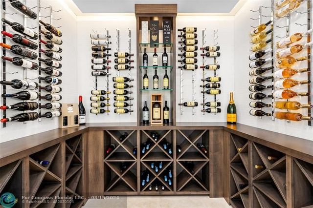 a kitchen filled with stainless steel appliances granite countertop a sink a stove and a refrigerator