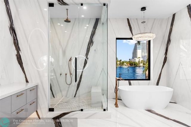 a view of swimming pool with a patio