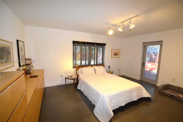 a bed room with a bed and furniture